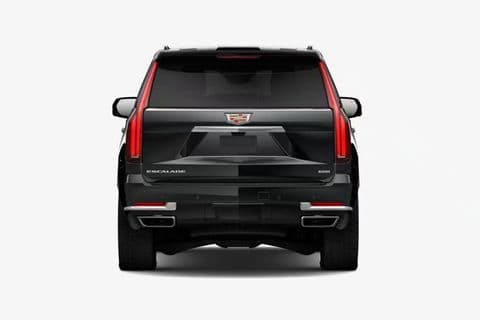 The Cadillac Escalade Platinum square-on from behind, full-height tail lamps and twin exhaust outlets.
