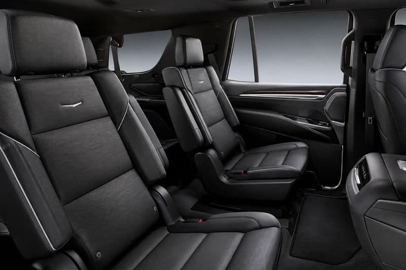 Luxury black leather passenger interior of a Cadillac Escalade ESV used by Stellar Executive Transport in Calgary.